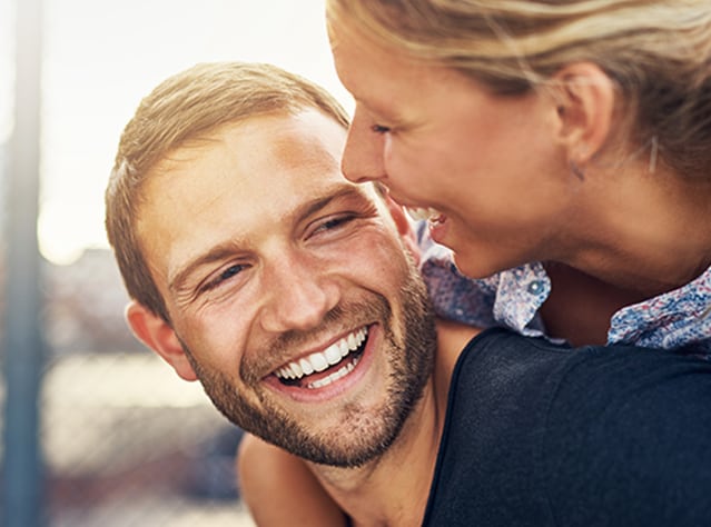 Smiling young couple having great time, happy after Canesten treatment